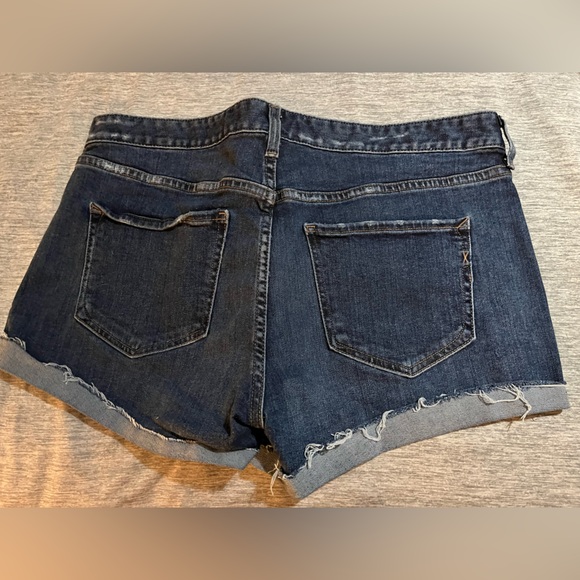 Express- size 14-medium blue denim Shortie Low Rise shorts with raw cuffs. - Picture 2 of 3
